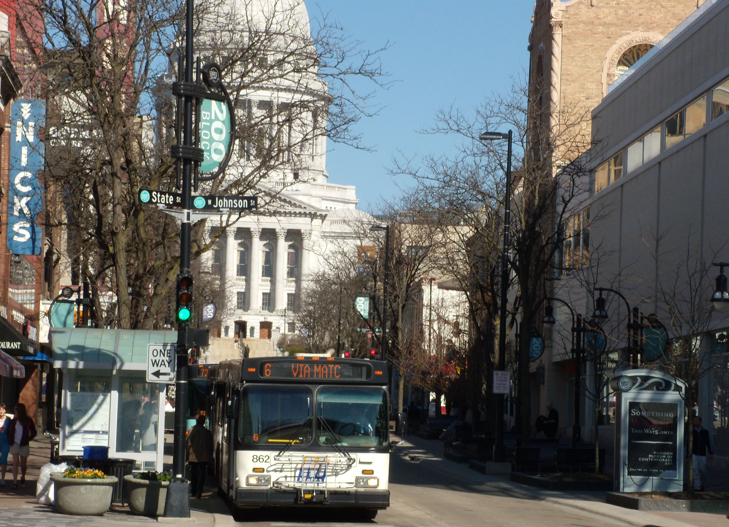 Metro transit bus on State Street in Madison with state capitol in background